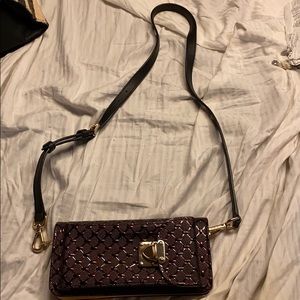 Burgundy wristlet. Used once.